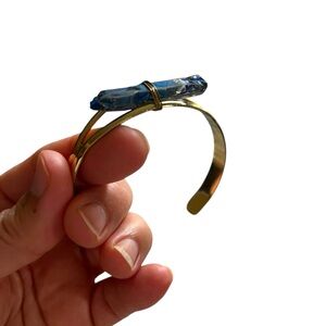 Gold plated cuff bangle bracelet with a raw stone